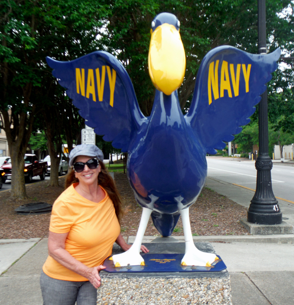 Karen Duquette and  U.S. Navy Pelican statue